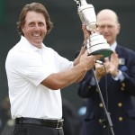 Phil Mickelson of the United States holds up the Claret Jug trophy after winning the British Open Golf Championship at Muirfield, Scotland, Sunday, July 21, 2013. (AP Photo/Matt Dunham)