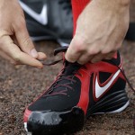 Washington Nationals pitcher Stephen Strasburg laces up his shoes before the start of a spring training baseball workout Thursday, Feb. 14, 2013, in Viera, Fla. (AP Photo/David J. Phillip)