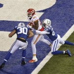 Kansas City Chiefs wide receiver Dwayne Bowe (82) scores a touchdown as Indianapolis Colts free safety Darius Butler (20) and strong safety LaRon Landry (30) defend during the first half of an NFL wild-card playoff football game Saturday, Jan. 4, 2014, in Indianapolis. (AP Photo/AJ Mast)