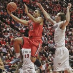  Arizona guard Nick Johnson blows past San Diego State forward Matt Shrigley while scoring during the second half of Arizona's 69-60 victory in a NCAA college basketball game Thursday, Nov. 14, 2013, in San Diego. (AP Photo/Lenny Ignelzi)
