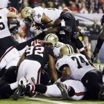New Orleans Saints running back Mark Ingram (28) goes over the top to score a touchdown during the first half of an NFL football game against the Atlanta Falcons, Thursday, Nov. 29, 2012, in Atlanta. (AP Photo/David Goldman)