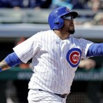 Chicago Cubs' Dioner Navarro hits a three-run home run during the first inning of an exhibition spring training baseball game against the San Francisco Giants, Sunday, Feb. 24, 2013, in Mesa, Ariz. (AP Photo/Morry Gash)