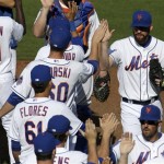 New York Mets relief pitcher Bobby Parnell, right, celebrates with teammates after beating the Washington Nationals 5-3 in an exhibition spring training baseball game in Port St. Lucie, Fla., Saturday, Feb. 23, 2013. The Mets won 5-3. (AP Photo/Julio Cortez)
