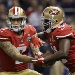 San Francisco 49ers quarterback Colin Kaepernick (7) hands the ball off to running back Frank Gore (21) in the first quarter of the NFL Super Bowl XLVII football game against the Baltimore Ravens, Sunday, Feb. 3, 2013, in New Orleans. (AP Photo/Patrick Semansky)