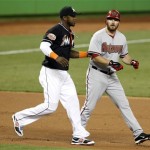 Arizona Diamondbacks' Jason Kubel, right, is tagged out by Miami Marlins third baseman Hanley Ramirez, left, in the first inning during a baseball game in Miami, Friday, April 27, 2012. (AP Photo/Lynne Sladky)