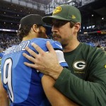 Detroit Lions quarterback Matthew Stafford (9) hugs Green Bay Packers quarterback Aaron Rodgers after an NFL football game at Ford Field in Detroit, Thursday, Nov. 28, 2013. The Lions won 40-10. (AP Photo/Paul Sancya)