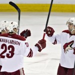  Phoenix Coyotes' Mikkel Boedker, left, Oliver Ekman-Larsson (23) and David Schlemko (6) celebrate a goal against the Edmonton Oilers during the first period of an NHL hockey game in Edmonton, Alberta, on Tuesday, Dec. 3, 2013. (AP Photo/The Canadian Press, Jason Franson)