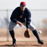 Cleveland Indians pitcher Justin Masterson fields a ball during baseball spring training in Goodyear, Ariz., Tuesday, Feb. 12, 2013. (AP Photo/Paul Sancya)