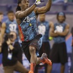 Michigan receiver Denard Robinson runs a drill during the NFL football scouting combine in Indianapolis, Sunday, Feb. 24, 2013. (AP Photo/Dave Martin)