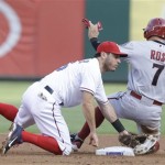 Arizona Diamondbacks' Cody Ross (7) steals second base asst Texas Rangers second baseman Ian Kinsler is late with the tag during the first second of a baseball game Thursday, Aug. 1, 2013, in Arlington, Texas. (AP Photo/LM Otero)