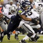  Seattle Seahawks linebacker Malcolm Smith, left, tackles Oakland Raiders running back Taiwan Jones in the first half of a preseason NFL football game, Thursday, Aug. 30, 2012, in Seattle. (AP Photo/Stephen Brashear)