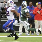 Buffalo Bills running back Fred Jackson (22) runs away from New York Jets cornerback Antonio Cromartie (31) during the first half of an NFL football game Sunday, Sept. 22, 2013, in East Rutherford, N.J. (AP Photo/Bill Kostroun)
