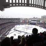  Fans react during the singing of the national anthem before an outdoor NHL hockey game between the New Jersey Devils and the New York Rangers Sunday, Jan. 26, 2014, at Yankee Stadium in New York. (AP Photo/Frank Franklin II)
