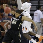  Illinois' Sam McLaurin (0) crashes into Colorado's Josh Scott (40) during the first half of a second-round game of the NCAA college basketball tournament Friday, March 22, 2013, in Austin, Texas. (AP Photo/David J. Phillip)
