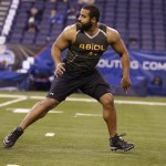 Penn State offensive lineman John Urschel runs a drill at the NFL football scouting combine in Indianapolis, Saturday, Feb. 22, 2014. (AP Photo/Michael Conroy)