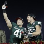 Michigan State linebacker Kyler Elsworth, left, celebrates with quarterback Connor Cook after Michigan State defeated Stanford 24-20 in the Rose Bowl NCAA college football game on Wednesday, Jan. 1, 2014, in Pasadena, Calif. (AP Photo/Jae C. Hong)