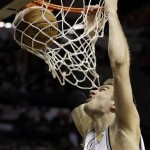San Antonio Spurs' Tiago Splitter (22), of Brazil, dunks against the Miami Heat during the first half at Game 3 of the NBA Finals basketball series, Tuesday, June 11, 2013, in San Antonio. (AP Photo/Eric Gay)