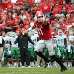 Georgia quarterback Aaron Murray (11) rolls out of the pocket before he throws an interception in the end zone in the first half of an NCAA college football game against North Texas at Sanford Stadium Saturday, Sept. 21, 2013, in Athens, Ga. (AP Photo/Atlanta Journal-Constitution, Jason Getz)