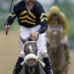 Jockey Gary Stevens celebrates aboard Oxbow after winning the 138th Preakness Stakes horse race at Pimlico Race Course, Saturday, May 18, 2013, in Baltimore. (AP Photo/Patrick Semansky)
