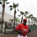 Philadelphia Phillies' Ryan Howard smiles to the cameras as he walks onto the field for a workout at baseball spring training, Thursday, Feb. 14, 2013, in Clearwater, Fla. (AP Photo/Matt Slocum)