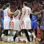 Oklahoma City Thunder's Kendrick Perkins, left, confronts Houston Rockets players as Thunder's Kevin Durant (35) and Serge Ibaka (9) stand nearby during the first quarter of Game 6 in a first-round NBA basketball playoff series Friday, May 3, 2013, in Houston. From left for Houston are Chandler Parsons, James Harden and Omer Asik. (AP Photo/Pat Sullivan)
