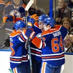  Edmonton Oilers' Mark Arcobello, left, David Perron, center, and Nail Yakupov (64) celebrate a goal against the Phoenix Coyotes during the first period of an NHL hockey game in Edmonton, Alberta, on Tuesday, Dec. 3, 2013. (AP Photo/The Canadian Press, Jason Franson)