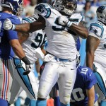 Carolina Panthers' Charles Johnson (95) reacts after sacking New York Giants quarterback Eli Manning (10) during the second half of an NFL football game in Charlotte, N.C., Sunday, Sept. 22, 2013. The Panthers won 38-0. (AP Photo/Mike McCarn)