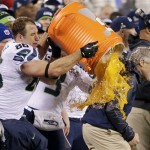 Seattle Seahawks' Zach Miller dumps Gatorade on Seattle Seahawks head coach Pete Carroll during the second half of the NFL Super Bowl XLVIII football game Sunday, Feb. 2, 2014, in East Rutherford, N.J. The Seahawks won 43-8. (AP Photo/Gregory Bull)