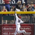 Arizona Diamondbacks' Justin Upton (10) cannot catch a two-run double hit by New York Mets' Scott Hairston during the first inning of a baseball game on Thursday, July 26, 2012, in Phoenix. (AP Photo/Matt York)