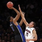  Duke's Jabari Parker (1) shoots against Arizona's Aaron Gordon (11) during the first half of an NCAA college basketball game in the NIT Season Tip-off tournament championship on Friday, Nov. 29, 2013, in New York. (AP Photo/Jason DeCrow)