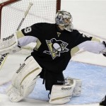 Pittsburgh Penguins goalie Marc-Andre Fleury makes a glove save in the third period of Game 1 of an NHL hockey Stanley Cup first-round playoff series against the New York Islanders on Wednesday, May 1, 2013, in Pittsburgh. The Penguins won 5-0. (AP Photo/Gene J. Puskar)