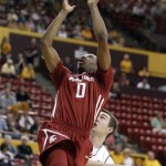 Washington State guard Marcus Capers, top, attempts a shot as he 
drives past Arizona State guard Chanese Creekmur, bottom, in the 
first half on an NCAA college basketball game on Saturday, Jan. 28, 
2012, in Tempe, Ariz. (AP Photo/Paul Connors)