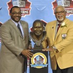 Inductee Curley Culp, right, poses with his presenter, his son Chad Culp, and a bust of himself during the induction ceremony at the Pro Football Hall of Fame Saturday, Aug. 3, 2013, in Canton, Ohio. (AP Photo/David Richard)
