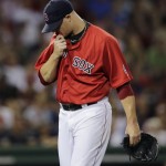 Boston Red Sox starting pitcher Jon Lester heads to the dugout after getting pulled in the fifth inning of a baseball game against the Arizona Diamondbacks at Fenway Park, Friday, Aug. 2, 2013, in Boston. (AP Photo/Charles Krupa)
