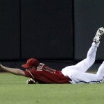 Arizona Diamondbacks center fielder A.J. Pollock dives for but misses the ball on a double by Chicago Cubs' Anthony Rizzo during the third inning of a baseball game Sunday, Sept. 30, 2012, in Phoenix. (AP Photo/Rick Scuteri)