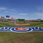 Grounds crew members prepare the infield before the Arizona Diamondbacks play the Chicago Cubs in a spring training baseball game on Thursday, Feb. 27, 2014, in Mesa, Ariz. It was the Cubs' first Cactus League game in their new spring training facility. (AP Photo/Matt York)