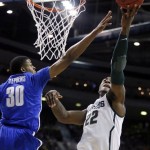 Memphis guard D.J. Stephens (30) defends against a shot by Michigan State forward Branden Dawson (22) in the first half of a third-round game of the NCAA college basketball tournament, Saturday, March 23, 2013, in Auburn Hills, Mich. (AP Photo/Duane Burleson)
