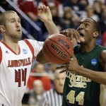 Colorado State forward Greg Smith, front right, loses control of the ball as he drives past Louisville forward Stephan Van Treese, front left, during a third-round NCAA college basketball tournament game on Saturday, March 23, 2013, in Lexington, Ky. (AP Photo/John Bazemore)
