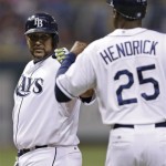 Tampa Bay Rays' Jose Molina, left, bumps fists with first base coach George Hendrick after hitting a sixth-inning single off Arizona Diamondbacks relief pitcher Will Harris during an interleague baseball game Tuesday, July 30, 2013, in St. Petersburg, Fla. (AP Photo/Chris O'Meara)