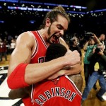 Chicago Bulls' Joakim Noah, top, celebrates with teammate Nate Robinson after defeating the Brooklyn Nets 99-93 in Game 7 of their first-round NBA basketball playoff series in New York, Saturday, May 4, 2013. The Bulls won the series to advance to a second-round series against the Miami Heat beginning Monday. (AP Photo/Julio Cortez)