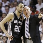 The San Antonio Spurs' Manu Ginobili (20) speaks with head coach Gregg Popovich during the first half in Game 7 of the NBA basketball championships against the Miami Heat, Thursday, June 20, 2013, in Miami. (AP Photo/Lynne Sladky)