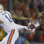 Florida State's Terrence Brooks (31) tries to tackle Auburn's Nick Marshall (14) during the second half of the NCAA BCS National Championship college football game Monday, Jan. 6, 2014, in Pasadena, Calif. (AP Photo/Mark J. Terrill)