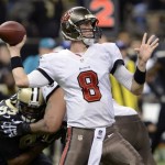  Tampa Bay Buccaneers quarterback Mike Glennon (8) passes under pressure from New Orleans Saints outside linebacker Junior Galette (93) in the second half of an NFL football game in New Orleans, Sunday, Dec. 29, 2013. (AP Photo/Bill Feig)
