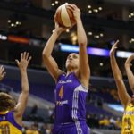 Phoenix Mercury's Candice Dupree, center, shoots over Los Angeles Sparks' Lindsey Harding, left, and Kristi Toliver, right, during the first half in Game 1 of their WNBA basketball Western Conference semifinal series on Thursday, Sept. 19, 2013, in Los Angeles. (AP Photo/Danny Moloshok)