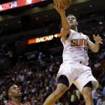  Phoenix Suns' Gerald Green (14) shoots over Miami Heat's Norris Cole, left, during the second half of an NBA basketball game, Monday, Nov. 25, 2013, in Miami. The Heat defeated the Suns 107-92. (AP Photo/Lynne Sladky)