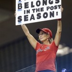 A Cleveland Indians fan holds a sign in the upper deck in the fifth inning of the AL wild-card baseball game between the Indians and the Tampa Bay Rays on Wednesday, Oct. 2, 2013, in Cleveland. (AP Photo/Tony Dejak)