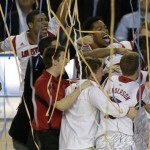 Louisville basketball players react after defeating Michigan during the second half of the NCAA Final Four tournament college basketball championship game Monday, April 8, 2013, in Atlanta. Louisville won 82-76. (AP Photo/Chris O'Meara)