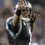 Carolina Panthers' Cam Newton (1) reacts after making a first down against the New England Patriots during the first half of an NFL football game in Charlotte, N.C., Monday, Nov. 18, 2013. (AP Photo/Mike McCarn)