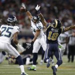 St. Louis Rams wide receiver Austin Pettis (18) cannot make a catch during the first half of an NFL football game against the Seattle Seahawks, Monday, Oct. 28, 2013, in St. Louis. Seattle Seahawks cornerback Richard Sherman (25) made the interception on the play. (AP Photo/Michael Conroy)