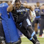 Notre Dame defensive lineman Louis Nix runs a drill at the NFL football scouting combine in Indianapolis, Monday, Feb. 24, 2014. (AP Photo/Michael Conroy)